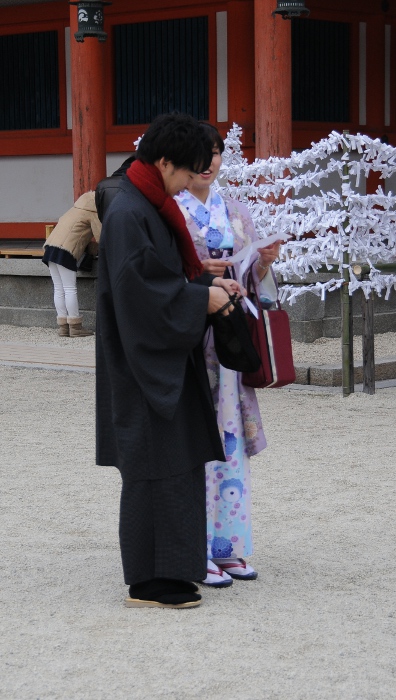 Checking fortunes at Heian shrine
