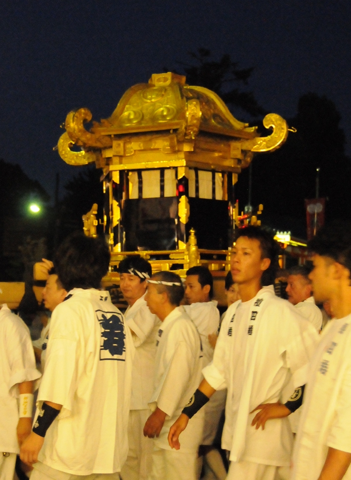 young men carrying the mikoshi