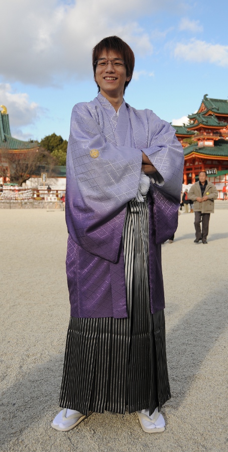 young man in samurai pose and clothing