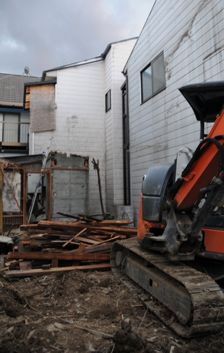 demolished house with bulldozer