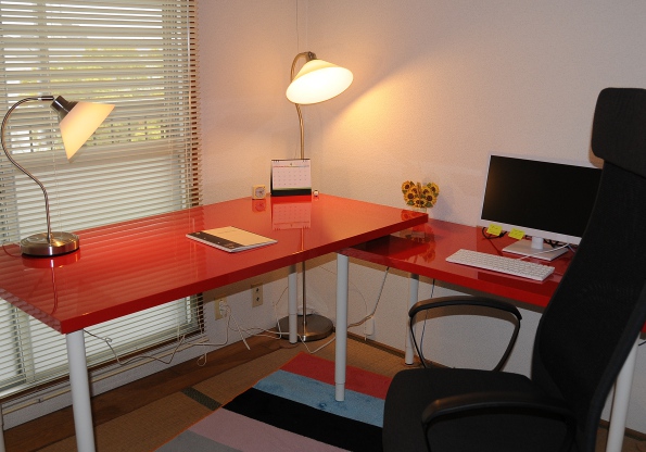 two bright red IKEA desks in my office