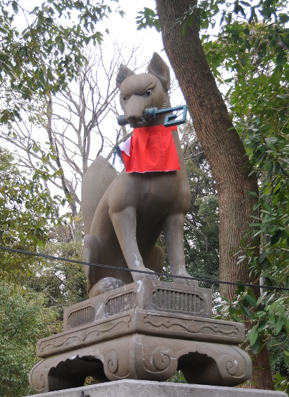 Fox statue at Fushimi with key