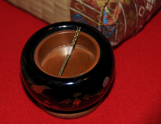 miniature hibachi with iron chopsticks