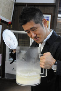 Kotaro inspecting the almost done sake
