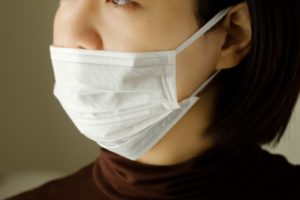 woman wearing a surgical mask